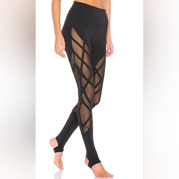 Alo Yoga High-Waist Wrapped Stirrup Legging in black with mesh panels. - Picture 1 of 7